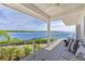 Relaxing deck overlooking the water with seating area at 750 Penfield St, Longboat Key, FL 34228