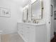 Bathroom with double vanity and updated fixtures at 750 Penfield St, Longboat Key, FL 34228
