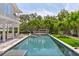 Inviting pool with spa and lush landscaping at 750 Penfield St, Longboat Key, FL 34228