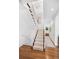 Elegant staircase with hardwood floors and neutral color palette at 750 Penfield St, Longboat Key, FL 34228