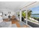Eat-in kitchen with water views and access to deck at 750 Penfield St, Longboat Key, FL 34228