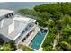 Luxury waterfront home with pool and lush landscaping at 750 Penfield St, Longboat Key, FL 34228