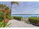 Relaxing backyard with pergola, swing, and waterfront access at 750 Penfield St, Longboat Key, FL 34228