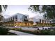 Modern townhouses with sleek design and ample parking, illuminated at dusk at 1611 4Th St # B6, Sarasota, FL 34236