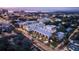Night aerial view of modern townhouses near the coast, illuminated at dusk at 1611 4Th St # B6, Sarasota, FL 34236