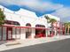 White building with red accents and outdoor seating at 1611 4Th St # B6, Sarasota, FL 34236