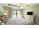 Main bedroom with plush bed, dresser, and backyard access at 2017 Lovoy Ct, North Port, FL 34288