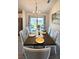 Dining room with large table, seating for six, and sliding glass doors to backyard at 2017 Lovoy Ct, North Port, FL 34288