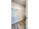 Spacious walk-in closet with wood-look flooring and ample hanging space at 2017 Lovoy Ct, North Port, FL 34288