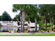 Community entrance with a pond and landscaping at 2017 Lovoy Ct, North Port, FL 34288