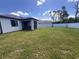 Large backyard with grassy lawn and privacy fence at 2017 Lovoy Ct, North Port, FL 34288
