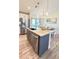 Kitchen island with granite countertop and stainless steel dishwasher at 2017 Lovoy Ct, North Port, FL 34288
