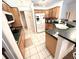 Spacious kitchen featuring ample cabinetry, stainless steel appliances, and a breakfast bar at 623 147Th E St, Bradenton, FL 34212
