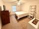 Comfortable bedroom with a full-size bed and built-in shelving at 623 147Th E St, Bradenton, FL 34212