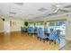 Community dining room with tables and chairs, pool view at 1350 N Portofino Dr # 310, Sarasota, FL 34242
