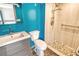 Clean bathroom with teal walls and walk-in shower at 1350 N Portofino Dr # 310, Sarasota, FL 34242