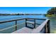 Private dock with bench overlooking the calm water at 1350 N Portofino Dr # 310, Sarasota, FL 34242
