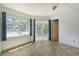 Bedroom with tile floors, sliding glass doors to screened balcony at 1350 N Portofino Dr # 310, Sarasota, FL 34242