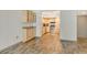 Open concept kitchen with light wood cabinets and stainless steel appliances at 1350 N Portofino Dr # 310, Sarasota, FL 34242