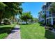 Brick paved walkway next to lush green lawn at 1350 N Portofino Dr # 310, Sarasota, FL 34242