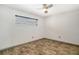 Simple bedroom with tile floors and window with blinds at 1350 N Portofino Dr # 310, Sarasota, FL 34242