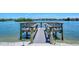 Private wooden dock with seating, perfect for enjoying waterfront views at 1350 N Portofino Dr # 310, Sarasota, FL 34242