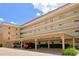 Condo building with parking and landscaping at 1350 N Portofino Dr # 310, Sarasota, FL 34242