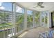 Bright sunroom with sliding glass doors and water views at 1350 N Portofino Dr # 310, Sarasota, FL 34242