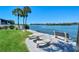 Enjoy the view from this waterfront patio, complete with a table and benches at 1350 N Portofino Dr # 310, Sarasota, FL 34242