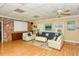 Relaxing community room with comfortable seating and brick accent wall at 1350 N Portofino Dr # 310, Sarasota, FL 34242