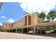 Building exterior showcasing covered parking and landscaping at 1350 N Portofino Dr # 310, Sarasota, FL 34242