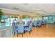 Community dining room with tables and chairs, pool view at 1350 N Portofino Dr # 310, Sarasota, FL 34242