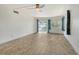 Living room with tile floors and sliding glass doors to balcony at 1350 N Portofino Dr # 310, Sarasota, FL 34242