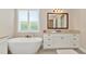 Relaxing bathroom with soaking tub and double vanity at 6358 Rivo Lakes Blvd, Sarasota, FL 34241