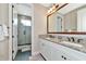 Modern bathroom with double vanity and large shower at 6358 Rivo Lakes Blvd, Sarasota, FL 34241