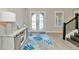 Bright entryway with double doors and a stylish console table at 6358 Rivo Lakes Blvd, Sarasota, FL 34241
