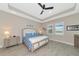 Spacious bedroom with a king-size bed and large windows at 6358 Rivo Lakes Blvd, Sarasota, FL 34241