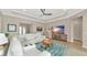 Bright living room with comfortable seating, large TV, and calming decor at 6358 Rivo Lakes Blvd, Sarasota, FL 34241
