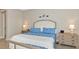 Spacious bedroom with a king-size bed and nightstands at 6358 Rivo Lakes Blvd, Sarasota, FL 34241