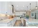 Gourmet kitchen with white cabinets, granite countertops, and ample counter space at 6358 Rivo Lakes Blvd, Sarasota, FL 34241