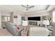 Entertainment area with comfortable seating and a large TV at 6358 Rivo Lakes Blvd, Sarasota, FL 34241