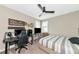 Bright bedroom with a bed, desk, and large TV at 6358 Rivo Lakes Blvd, Sarasota, FL 34241