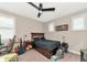 Bedroom with a double bed, dresser, and musical instrument setup at 6358 Rivo Lakes Blvd, Sarasota, FL 34241