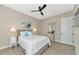 Guest bedroom with a queen bed, nightstands, and a mirrored dresser at 6358 Rivo Lakes Blvd, Sarasota, FL 34241