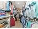 Large walk-in closet with ample shelving and hanging space at 6358 Rivo Lakes Blvd, Sarasota, FL 34241