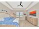 Spacious bedroom with a king-size bed and large windows at 6358 Rivo Lakes Blvd, Sarasota, FL 34241