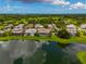 Bird's-eye view of lakefront community with upscale homes at 6358 Rivo Lakes Blvd, Sarasota, FL 34241