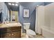 Clean bathroom with a single sink vanity, toilet, and tub shower combo at 8930 Tuscany Isles Dr, Punta Gorda, FL 33950