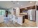 Spacious kitchen with island, stainless steel appliances, and wood cabinets at 8930 Tuscany Isles Dr, Punta Gorda, FL 33950