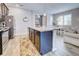 Open kitchen featuring an island, stainless steel appliances, and breakfast bar at 8930 Tuscany Isles Dr, Punta Gorda, FL 33950